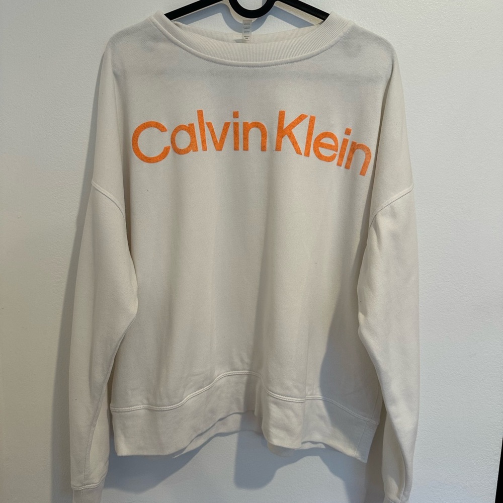 Calvin Klein Off-White Sweatshirt with Vibrant Orange Logo
